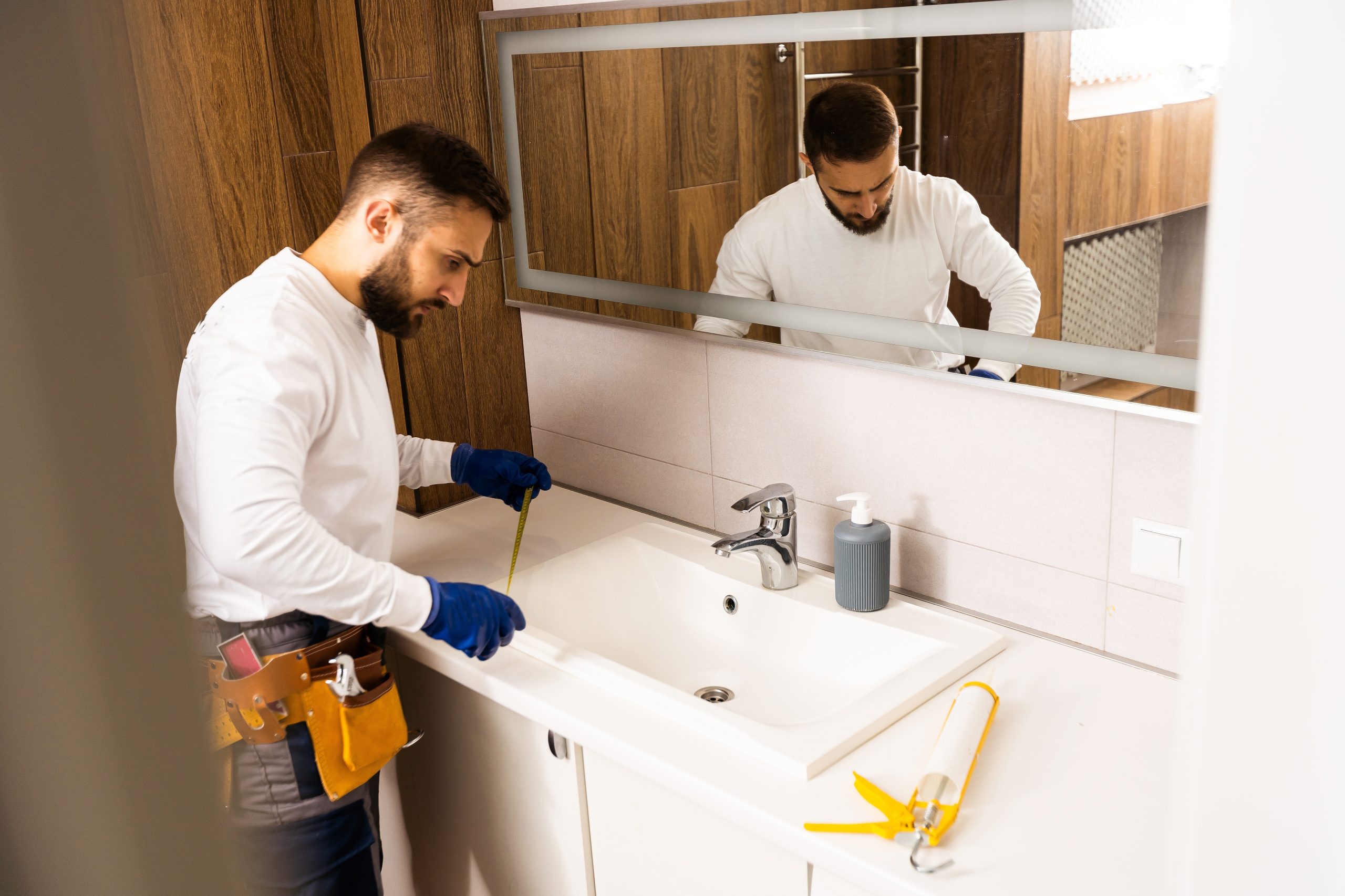 A,Worker,Installs,A,Wash,Basin,In,A,Bathroom.