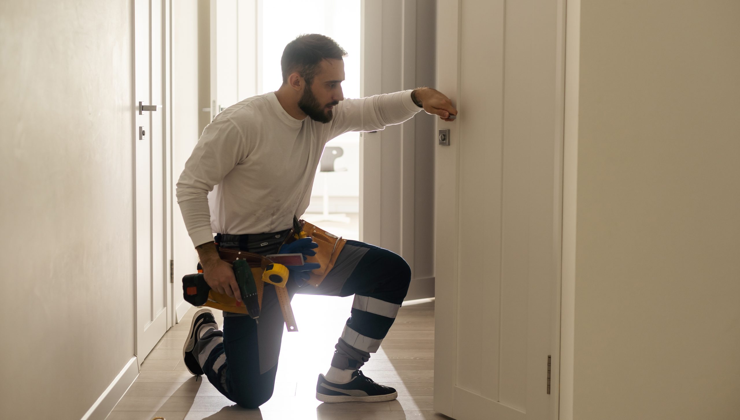 Portrait,Young,Male,Carpenter,Repairing,Door,Lock