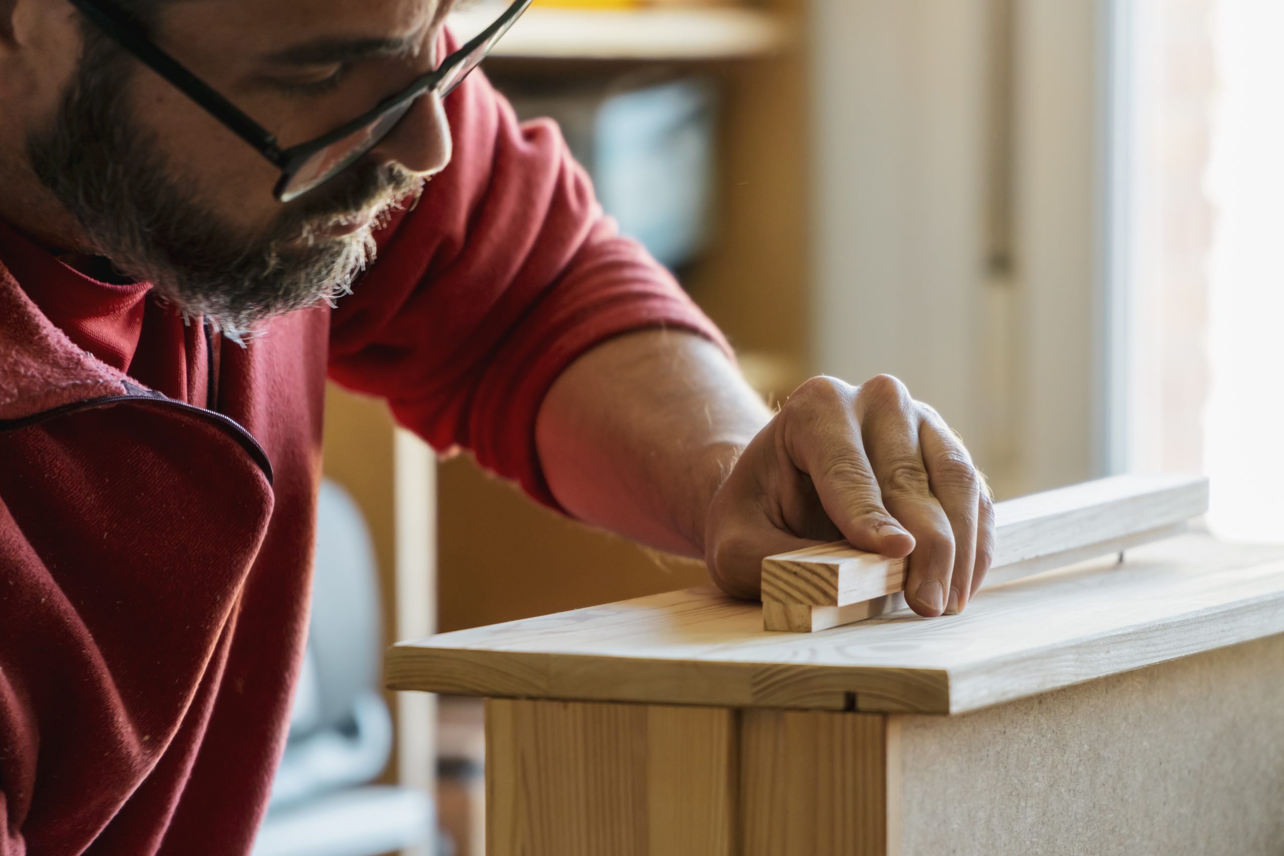 Closeup,Of,A,Carpenter's,Hand,Assembling,Timber.,Man,With,Beard